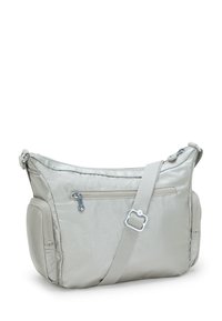 Gray nylon shoulder bag with a smooth texture, zip pockets, adjustable strap, and metallic accents. Rounded shape with a spacious design.