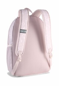 Zaino rosa con tessuto testurizzato, motivo floreale sulle spalline, lati in rete e un accento con logo. Spalline imbottite per il comfort.