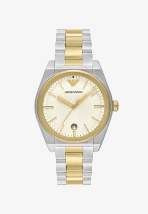 Klocka i rostfritt stål med silver- och guldton, med en rund, texturerad gul bezel, vit urtavla, guld timmarmarkörer och datumvisning vid klockan 6.