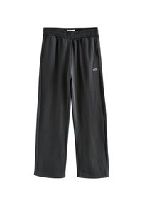 Zwarte sweatpants gemaakt van een zachte, rekbare stof, met een elastische tailleband, zijzakken en een klein "self." logo op de voorkant.