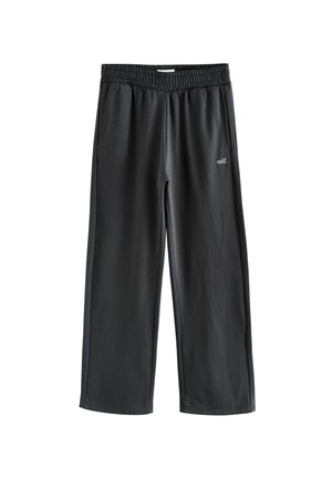 Sorte sweatpants lavet af et blødt, strækbart stof, med en elastisk talje, sidelommer og et lille "self." logo på forsiden.