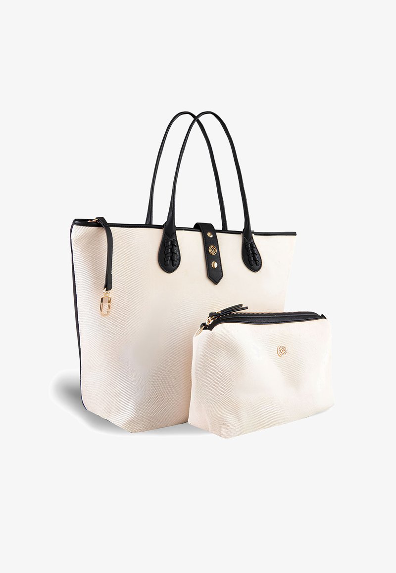 Tote bag in cream textured material with black leather accents, featuring braided handles and a small matching pouch with a zipper.
