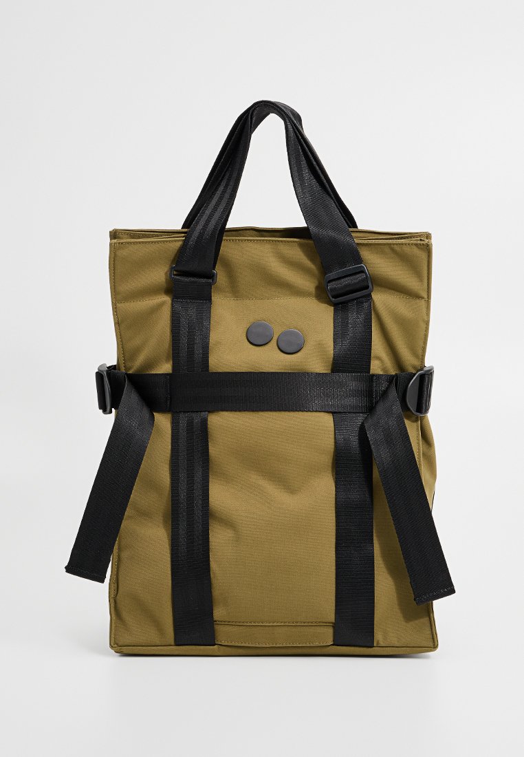 Olive green tote bag made of durable fabric, featuring black handles and straps, with two decorative black buttons on the front.