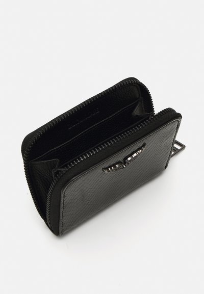Black zippered wallet made of textured leather with multiple compartments and a smooth metal accent on the front. Compact rectangular shape.