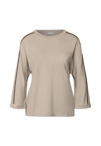 Beige Langarmhemd aus weichem Stoff. Mit umgeschlagenen Ärmeln und schwarzen seitlichen Streifen für den Kontrast. Rundhalsausschnitt mit einer entspannten Passform.
