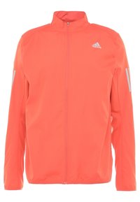 Veste Adidas zippée intégralement orange vif avec col montant et bandes réfléchissantes sur les manches, logo Adidas devant sur la poitrine gauche.