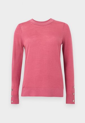 Long-sleeve pink sweater made of soft fabric, featuring a fitted neckline and button accents on the cuffs. Smooth texture, solid color design.