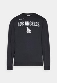 Melna garuma piedurkņu sporta krekls, kas izgatavots no kokvilnas maisījuma, ar baltu uzrakstu "LOS ANGELES" un "LA". Ribotās piedurkņu un apakšmalas. Nike logo uz pleca.
