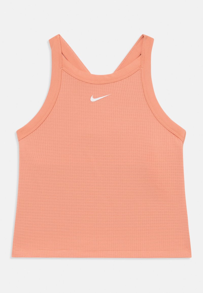 Persikinio spalvos sportinė marškelis su tekstūruotu audiniu, plačiomis petnešomis ir baltu Nike logotipu ant krūtinės. Sukurtas patogumui ir našumui.