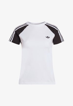 Bijela pamučna majica kratkih rukava s crnim raglan rukavima i tri bijele pruge. Ima mali crni logo na prsima. Klasični okrugli izrez.