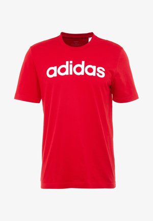 Camiseta roja de manga corta con el logo "adidas" en blanco impreso en el pecho, cuello redondo y corte regular.