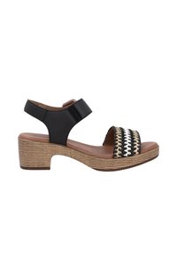 Black sandal with woven multicolored strap, tan footbed, and textured light brown block heel. Adjustable ankle strap for fit.