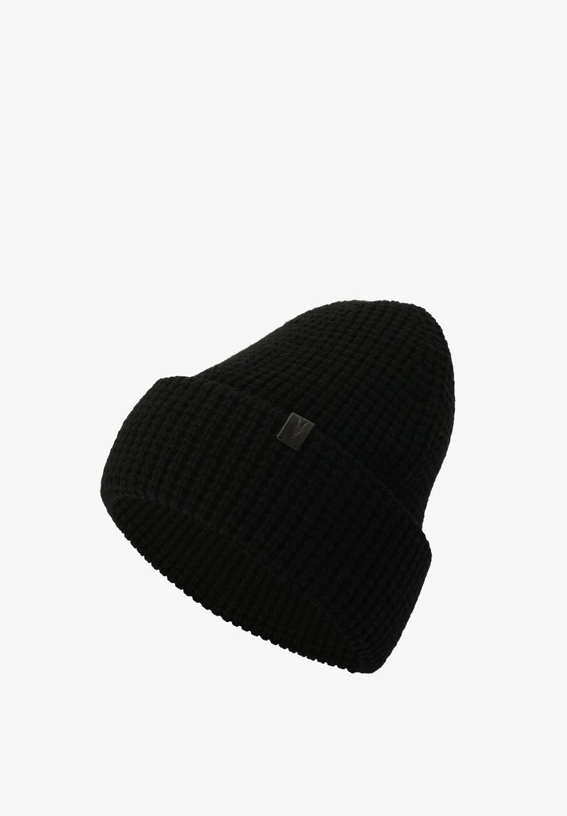 Gorro de punto negro con un patrón texturizado a rayas y un puño doblado. Presenta una pequeña etiqueta cuadrada con el logo en la parte frontal.