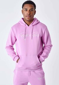 Sudadera rosa con capucha, bolsillo delantero, cordones y texto bordado en blanco "Project x Paris". Hecha de tela suave, con un ajuste relajado.