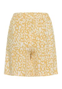 Shorts amples à imprimé léopard jaune et blanc, avec taille élastique et longueur mi-cuisse.