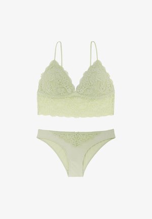 Světle zelený krajkový bralet s nastavovacími ramínky a odpovídajícími bikiny s krajkovým lemem. Měkká textura s květinovými vzory a dvěma mašlemi.