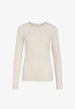 Pikad varrukadega t-särk, valmistatud pehmest, helebeežist kangast. Funktsioonid ümara kaelusega ja keha järgiva lõikega, nähtavate mustrite või kaunistusteta.