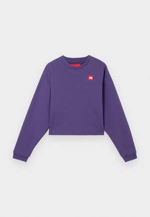 Sweatshirt roxo cropped com mangas longas, decote redondo e um patch de logótipo vermelho no lado esquerdo do peito. Material de algodão suave.