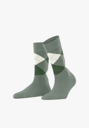 Zielono-kremowe skarpetki w wzór argyle, o miękkiej fakturze, z prążkowanym mankietem, diamentowymi wzorami i subtelnymi fioletowymi akcentami.