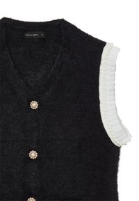 Gilet nero realizzato in tessuto testurizzato, con scollatura a V, bottoni decorativi in perle e bordo bianco arricciato lungo le spalle.