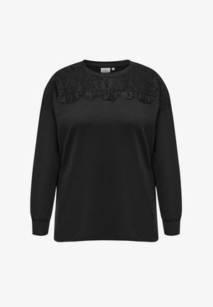 Čierna mikina s dlhým rukávom, ktorá má čipkovanú aplikáciu na vrchnej časti prednej strany. Tkanina je hladká, s rebrovanými manžetami a okrúhlym výstrihom.