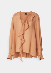 Ferskenfarget bluse med lange ermer, volangdetaljer foran og V-hals. Laget av lett, glatt stoff. Har knappedetaljer.