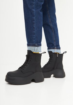 Bottines à plateau - mottled black