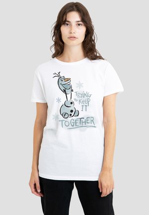 White cotton t-shirt featuring a cartoon character and the text "Trying to keep it together," with snowflake accents in light blue.