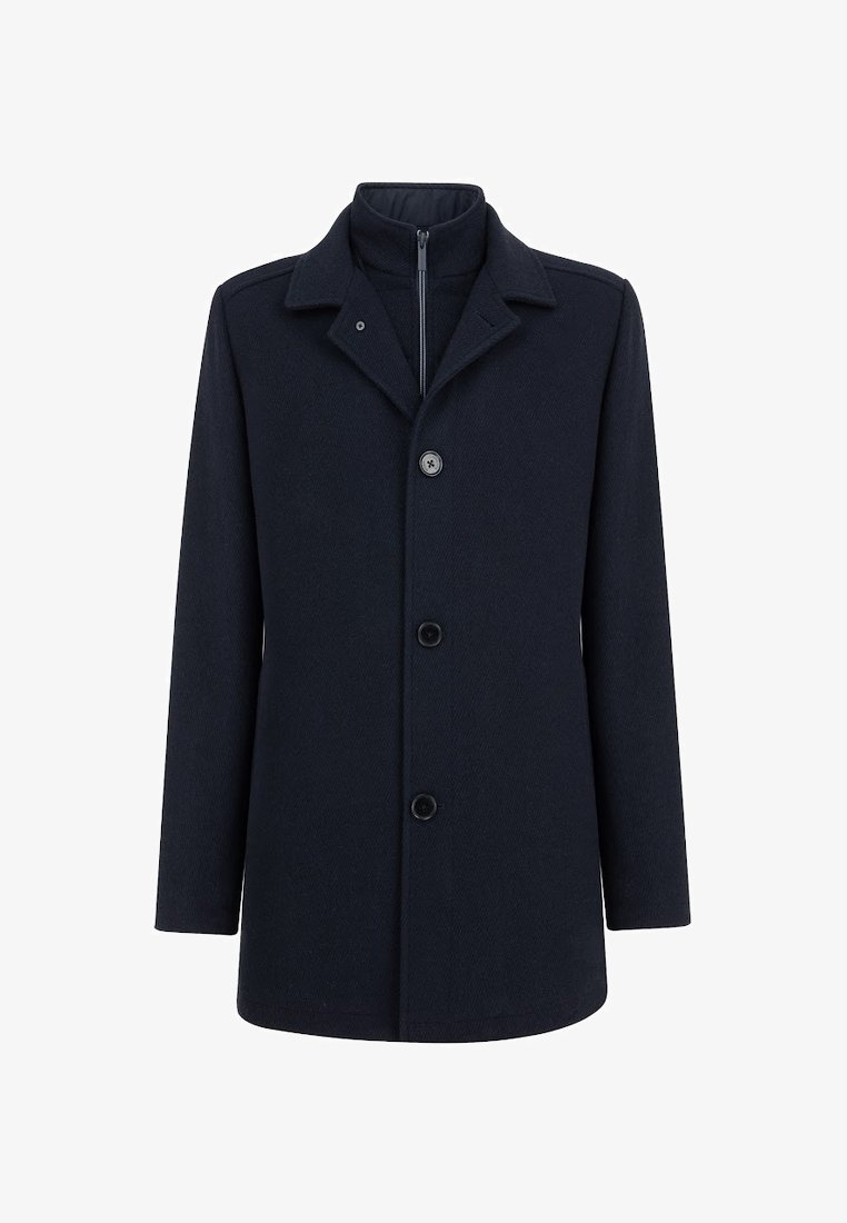 Granatowy płaszcz z wełny z domieszką, z kołnierzem, przednim zamkiem i pięcioma guzikami. Prosty fason z długimi rękawami o gładkiej teksturze.