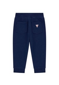 Marineblauwe sweatpants van zachte stof met een elastische tailleband, taps toelopende manchetten en twee achterzakken met een driehoekig logo-detail.