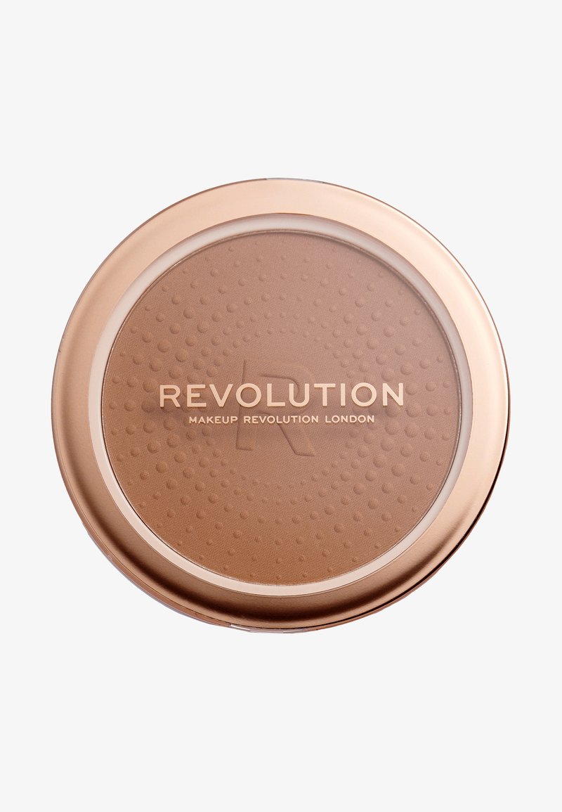 Rund bronzer compact med en glat, lysebrun pudderoverflade med et struktureret mønster. Kassen er guldfarvet med et klart låg.