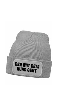 Gray knit beanie with a folded cuff, featuring a rectangular patch labeled "DER MIT DEM HUND GEHT" in bold black text.