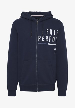 Mørkeblå zip-up hoodie lavet af blødt stof, med en front-kangaroo lomme, justerbar snørelukning i hætten og trykt tekstdesign.