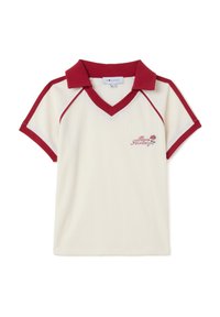 Crème polo met korte mouwen en een rode kraag en accenten. Heeft een v-hals en geborduurd rozenmotief aan de linkerkant. Gestructureerde stof.