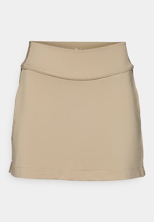 Beżowa spódnica z elastycznego materiału z dopasowaną talią i delikatnym rozkloszowaniem, charakteryzująca się gładką fakturą i prostymi liniami. Brak widocznych wzorów lub elementów metalowych.