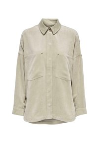 Helles grünes Kordhemd mit Knopfverschluss, Kragen, zwei Brusttaschen und weiten Ärmeln. Es hat eine sichtbare vertikale Rippstruktur.