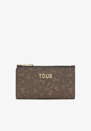Brown Tous wallet with abstract line pattern, gold zipper, and gold Tous logo centered on the front.