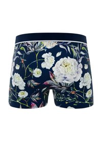 Boxers pour hommes à motif floral avec un fond bleu marine, des dessins de pivoines blanches et de feuilles, et une ceinture contrastante.