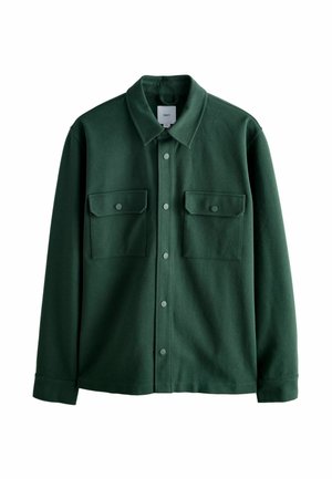 Green, button-up shirt jacket made of soft fabric. Features a classic collar, two chest pockets with snap buttons, and long sleeves.