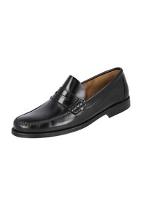 Mocasín de cuero negro con un acabado suave, costuras definidas y una correa decorativa en la parte delantera. Tacón bajo y punta en forma de almendra.