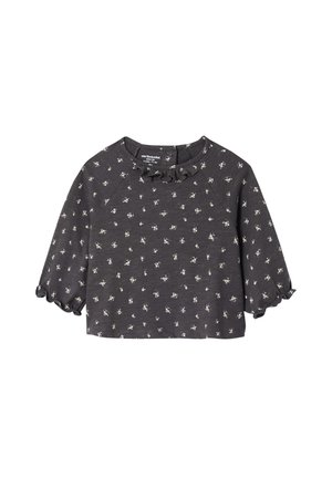 Dark gray short-sleeve top with a ruffled neckline and white floral patterns. Soft fabric with a relaxed fit and slightly flared sleeves.