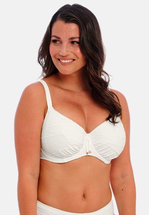 White bra with textured fabric, underwire support, and adjustable straps. Features a central decorative detail. Smooth finish.