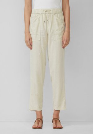 Helle beige Leinenhose mit elastischem Bund, verstellbarem Kordelzug und zwei Fronttaschen. Betont durch einen lässigen, geraden Schnitt.