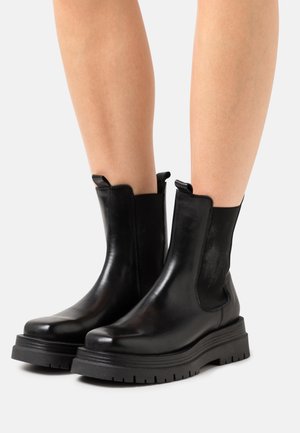 ELIDA - Platform ankle boots - black