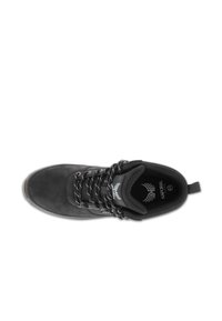 Black suede ankle boot with a flat sole, featuring black and white patterned laces and a pull tab at the heel. Logo visible on the tongue.