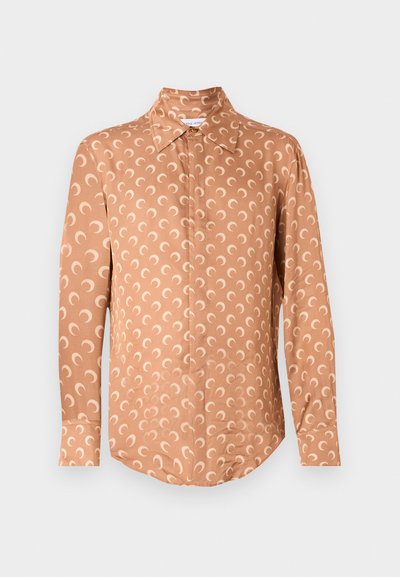 Long-sleeve shirt in light brown with a cream crescent moon pattern, featuring a classic collar and button closure. Smooth fabric texture.