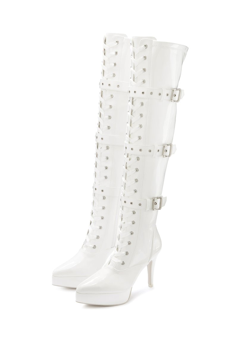 White patent leather knee-high boots with a pointed toe, lace-up front, and three buckle straps; features a high stiletto heel and platform sole.