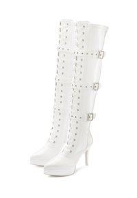White high-heeled knee-high boots made of patent leather with lace-up front, buckled straps, and a pointed toe design.