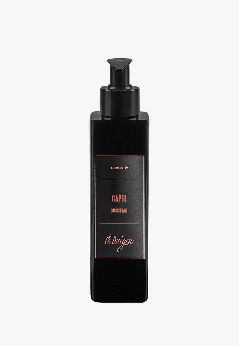 Schwarze rechteckige Flasche mit Pumpenz dispenser; verfügt über ein schlichtes Etikett mit "CAPRI DUSCHBAD" in zurückhaltender Typografie mit roségoldenen Akzenten.