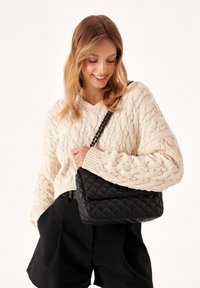 Kazar VIDIA - Cross body bag - black